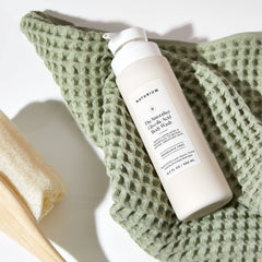 Naturium The Smoother glycolic body wash bottle with pump for easy daily use