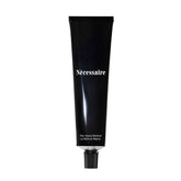 necessaire hand retinol bottle close-up for nightly repair benefits