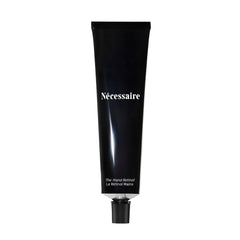 necessaire hand retinol bottle close-up for nightly repair benefits