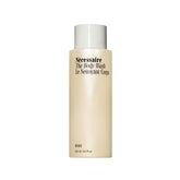 Nécessaire Hinoki body wash bottle closeup showing nourishing oils for dry skin