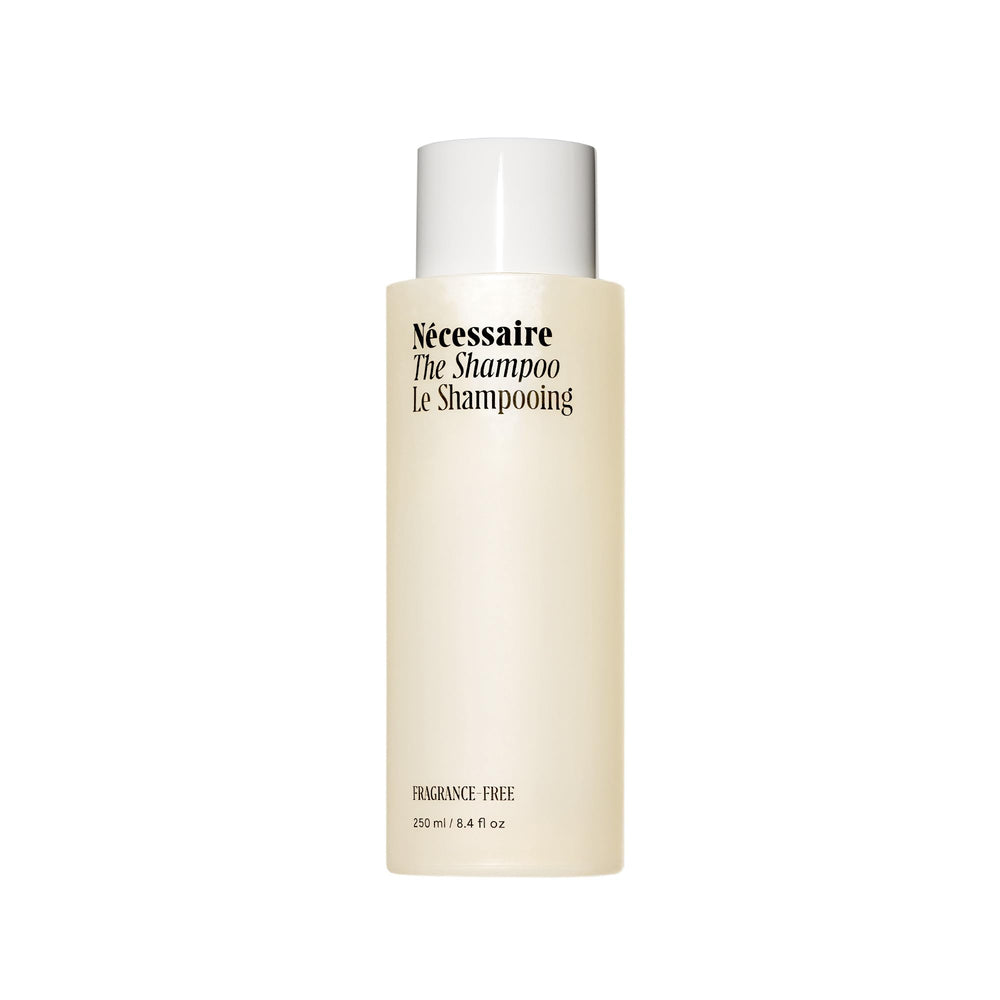 Nécessaire The Shampoo bottle with hyaluronic acid for scalp hydration.