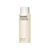 Nécessaire The Shampoo bottle with hyaluronic acid for scalp hydration.