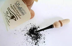 Nefertari eyeliner powder compact open shows pigments for precise application.
