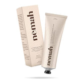 Nemah stretch mark cream bottle highlighting a creamy texture for pregnancy care.