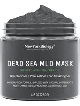 New York Biology Dead Sea Mud Mask on the face during application for pore refinement.
