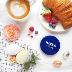 NIVEA Creme 200ml texture swirl shows creamy moisture for soft, smooth skin.