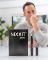 NIXXIT nail biting pen close-up shows clear, bitter formula for deterrence.