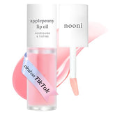 NOONI Applepeony lip oil bottle close-up shows silky texture and glow