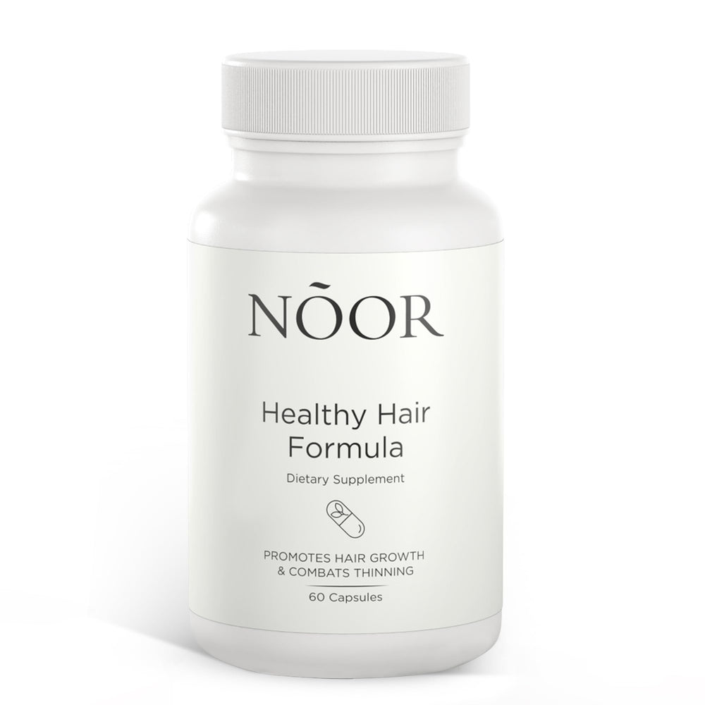NOOR HAIR Healthy Hair Formula bottle on the counter ready for daily use.