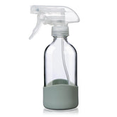 OCMML 8oz clear glass spray bottle with silicone sleeve shows liquid level for easy refills.