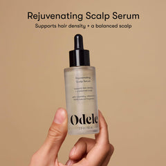 Odele Rejuvenating Scalp Serum dropper applying serum to scalp