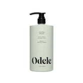 Odele Smoothing Shampoo bottle front view highlighting extra moisture and frizz control.