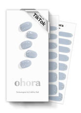 ohora N Felice blue glitter nail strips demonstrate at-home manicure ease and salon-quality shine.