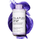 Olaplex 4P bottle demonstrates brass-neutralizing purple toning for blond hair.