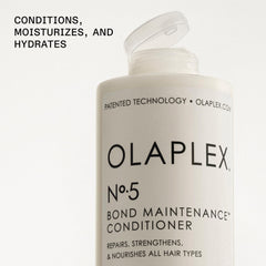 Olaplex Nº5 bottle shown with hair shine on a styled strand.