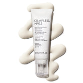 Olaplex No. 0.5 bottle pour for targeted scalp hydration.