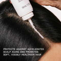Close-up of Olaplex No. 0.5 bottle showing lightweight scalp serum.