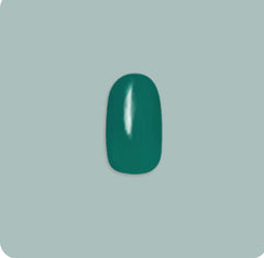 Olive & June emerald-green short-round nails brighten everyday looks.