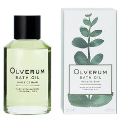 OLVERUM bath oil bottle on a spa setup for luxurious relaxation.
