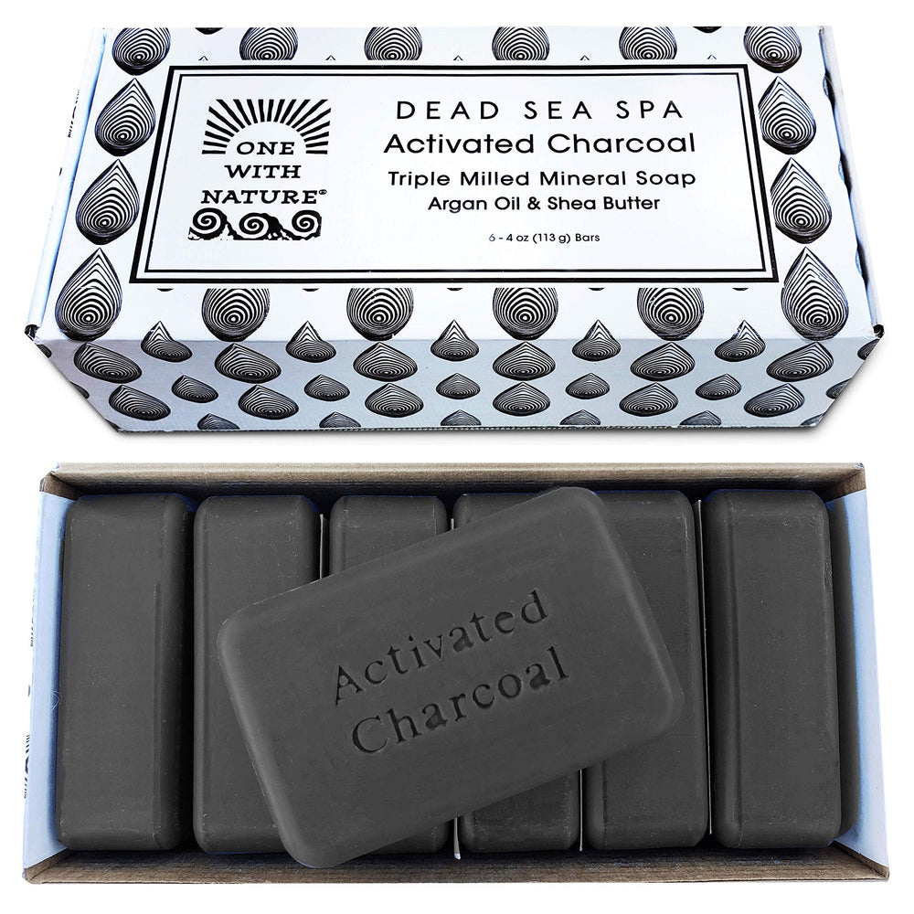 One With Nature charcoal soap bar foreground for detoxifying cleansing and brighter pores.