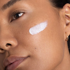 OneSkin FACE SPF OS-01 swatch demonstrates sheer tint blending.