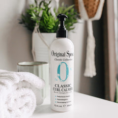 Original Sprout Curl Calmer applied to damp hair for easy styling.