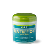 ORS Tea Tree Oil Hairdress, botella derramando, mejora brillo y nutrición del cuero cabelludo.