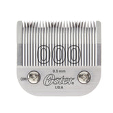 Oster detachable blade closeup shows 0.5 mm cut for precise fades.