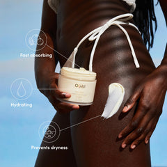 OUAI Body Cream St. Barts texture swirl highlights rich, velvety application.