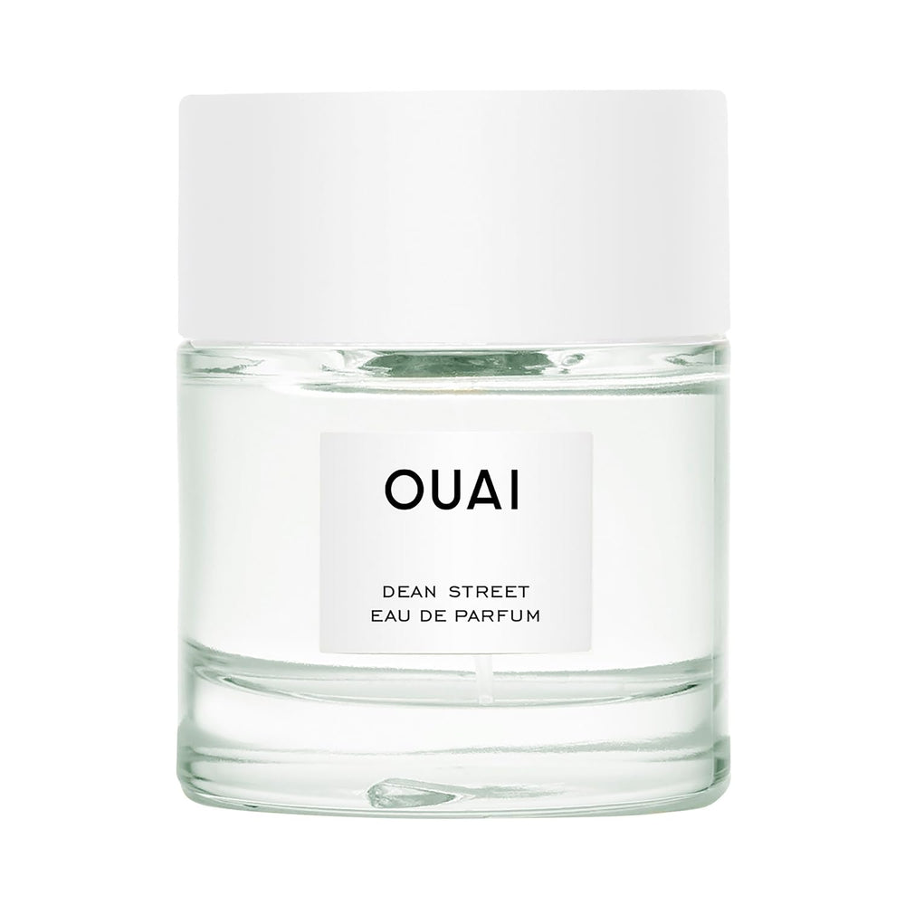 OUAI Dean Street bottle close-up shows bright citrus and floral notes for daily wear.