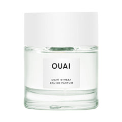 OUAI Dean Street bottle close-up shows bright citrus and floral notes for daily wear.