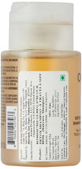 OUAI Detox Shampoo travel-size apple cider vinegar label highlights cleansing ingredients and detox potential