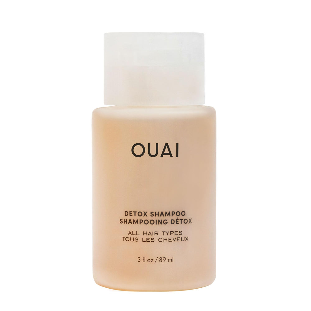 OUAI Detox Shampoo travel-size bottle shows clarifying formula for quick refresh and buildup removal