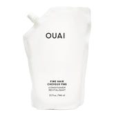 OUAI Fine Hair Conditioner Refill bottle closeup shows glossy hair-softening potential for volume and shine.