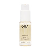 OUAI Hair Oil travel-size bottle provides portable frizz control and shine.