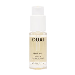 OUAI Hair Oil travel-size bottle provides portable frizz control and shine.