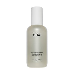 OUAI thickening spray bottle dispense shows instant lift from roots to ends
