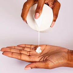 OUAI Hand Lotion ingredients visual featuring avocado, rosehip and jojoba oils.
