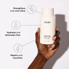 OUAI Medium Conditioner bottle close-up highlighting smooth texture and shine