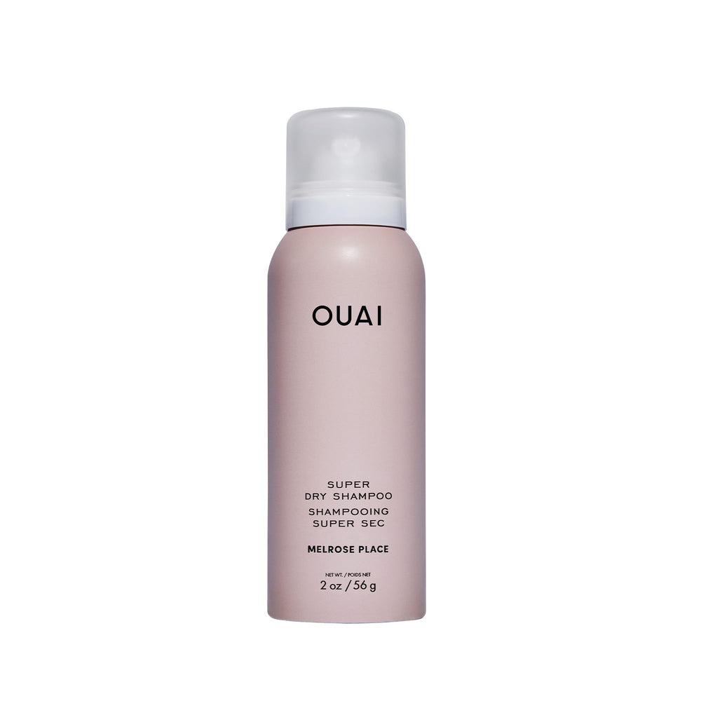 OUAI super travel dry shampoo bottle closeup for travel-ready refresh.