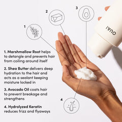OUAI Thick Hair Conditioner being applied to mid-lengths for moisture.