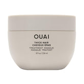 OUAI Thick Hair Mask bottle close-up showing deep conditioning for damaged hair