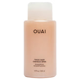 OUAI Thick Shampoo bottle closeup shows rich hydration for thick hair.