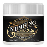 Oudetas Numbing Cream tube closeup highlighting a non-greasy formula for targeted relief.