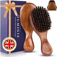 OUMIGIZ boar bristle brush with back-sculpted design for comfortable grip and refined styling