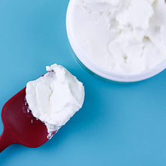 Oyin Handmade Whipped Pudding on hair demonstrates moisture and pliability during styling.