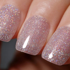 Ozzeal glitter gel polish bottle shows clear silver iridescent sparkle for at-home manicures
