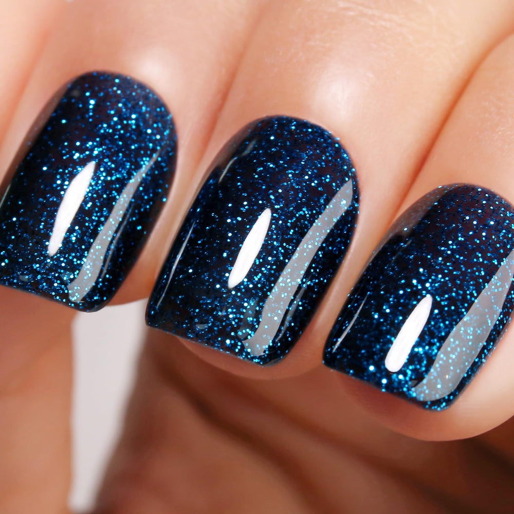 Ozzeal glitter gel polish dark navy glitter bottle showing vibrant shimmer for statement nails