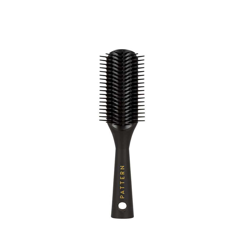 PATTERN Beauty Mini Shower Brush bristles closeup aiding gentle detangling of curls.