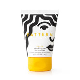 PATTERN Heavy Conditioner bottle hero highlights rich hydration for coils and curls.